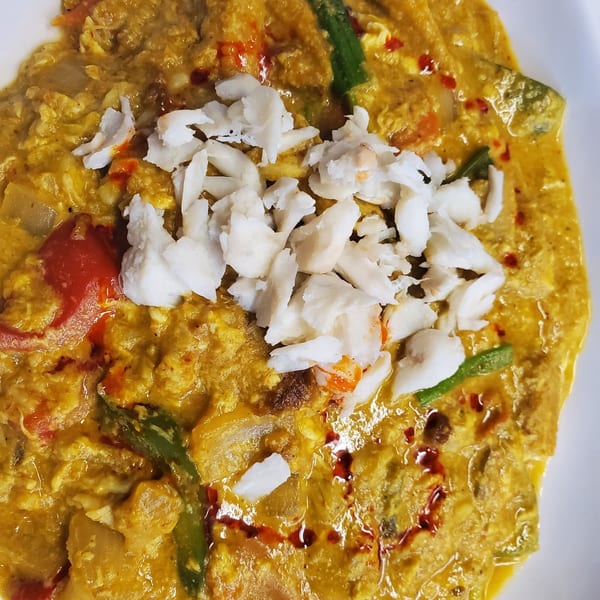 Close-up of Baan Thai's yellow curry with crab meat, red peppers, and green beans.